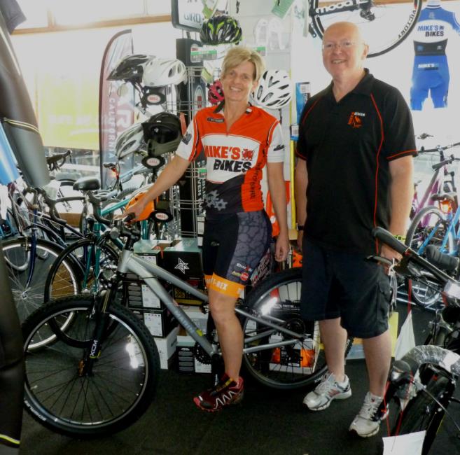Christa Bell-Evans with Mark Rendell of Mikes Bikes
